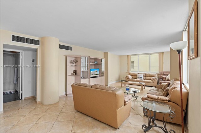 5005 Collins Ave Unit 425, Miami Beach, FL 33140 - living area featuring baseboards and light tile patterned flooring
