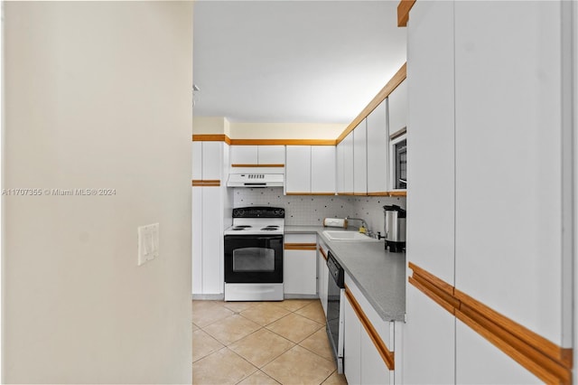 kitchen with white electric range, sink, tasteful backsplash, white cabinetry, and extractor fan