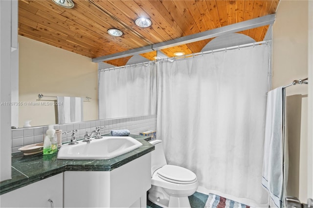 bathroom with vanity, toilet, wooden ceiling, and decorative backsplash