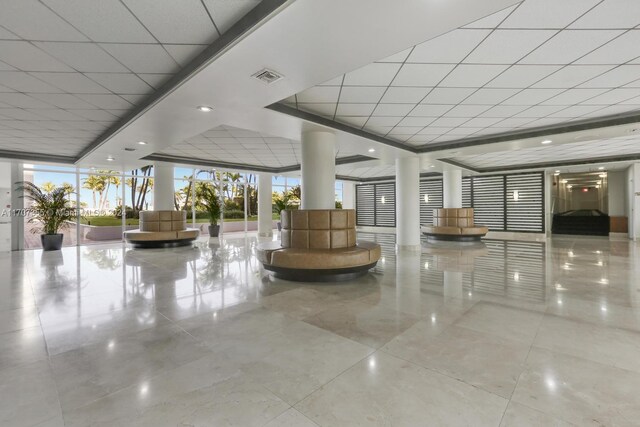 5005 Collins Ave Unit 425, Miami Beach, FL 33140 - building lobby with a paneled ceiling and floor to ceiling windows