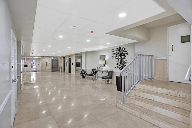 5005 Collins Ave Unit 425, Miami Beach, FL 33140 - building lobby with recessed lighting, a paneled ceiling, and stairway