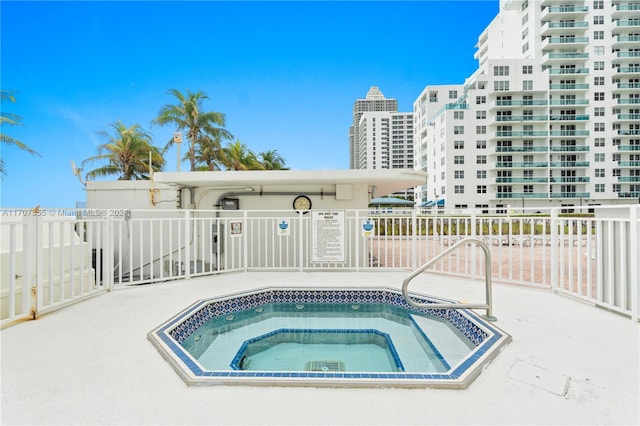 view of pool with a community hot tub