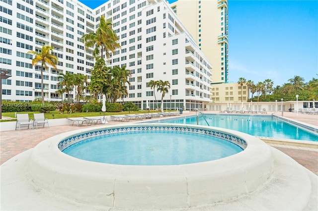 view of swimming pool featuring a patio area