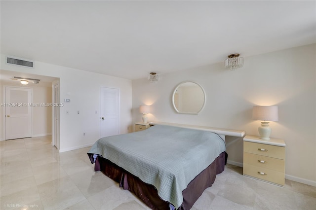 bedroom featuring visible vents and baseboards