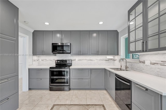 kitchen featuring gray cabinets, crown molding, sink, and appliances with stainless steel finishes