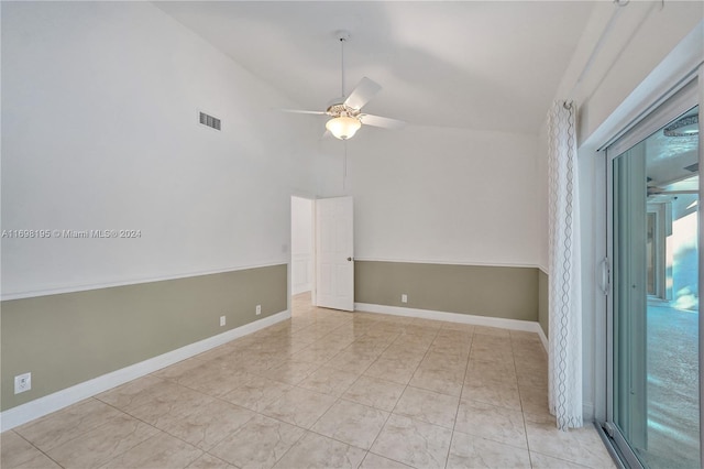 spare room featuring high vaulted ceiling and ceiling fan