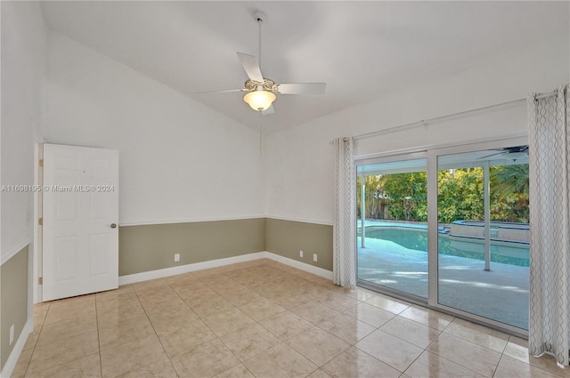 tiled empty room with ceiling fan