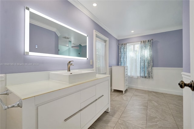 bathroom featuring vanity and ornamental molding