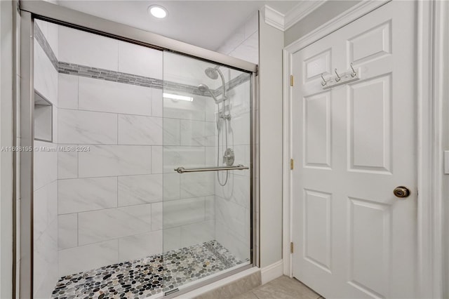 bathroom with tile patterned flooring and walk in shower