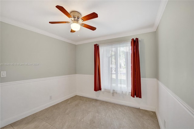 unfurnished room featuring ceiling fan and crown molding