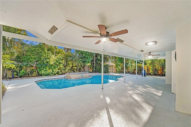 view of swimming pool featuring an in ground hot tub, a patio, and ceiling fan