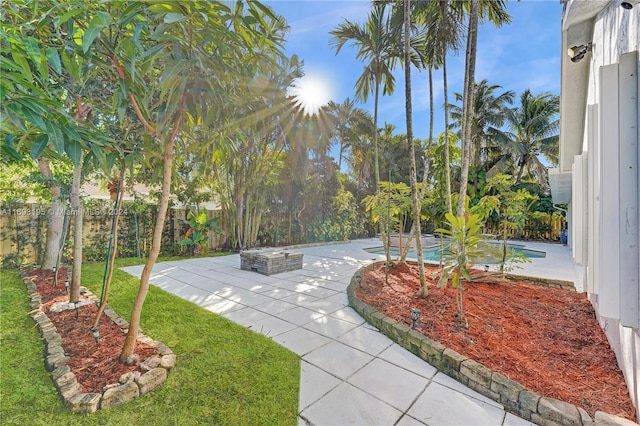 view of yard with a fenced in pool and a patio