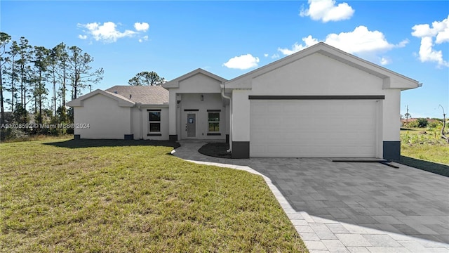 view of front of home with a front lawn and a garage