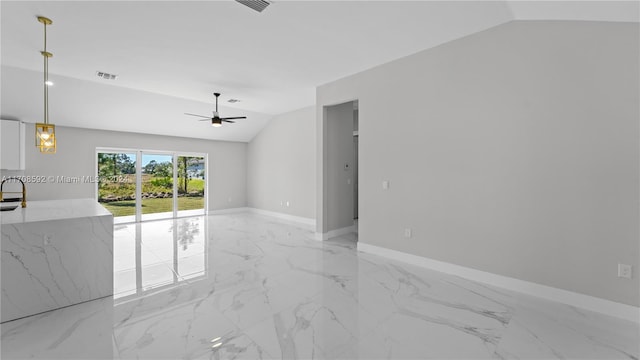 spare room featuring ceiling fan and lofted ceiling