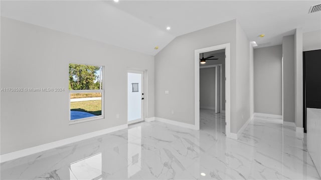 unfurnished room featuring ceiling fan and vaulted ceiling