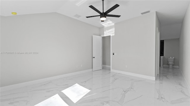 spare room with ceiling fan and vaulted ceiling