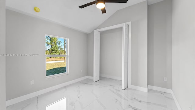 unfurnished bedroom featuring ceiling fan, a closet, and vaulted ceiling