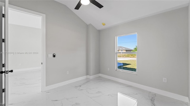 unfurnished room with ceiling fan and vaulted ceiling