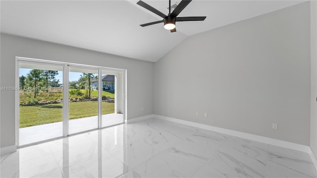 spare room featuring ceiling fan and vaulted ceiling