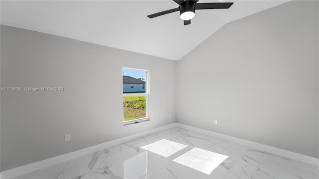 spare room with ceiling fan and lofted ceiling