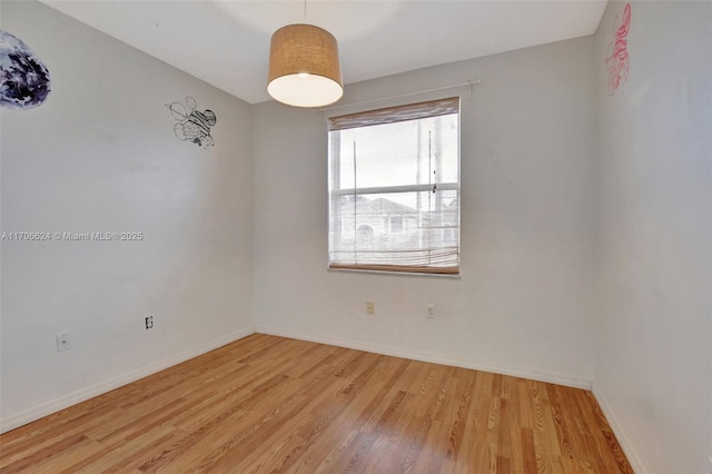 unfurnished room featuring light hardwood / wood-style flooring