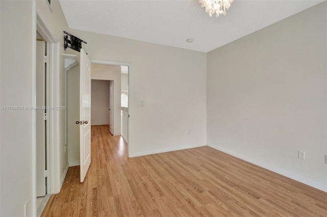 spare room featuring light wood-type flooring