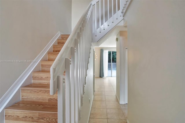 stairs with tile patterned flooring