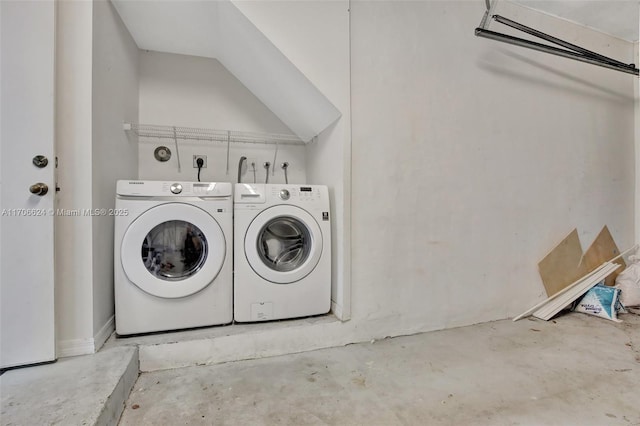 washroom with washer and dryer