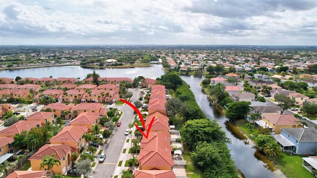 birds eye view of property featuring a water view