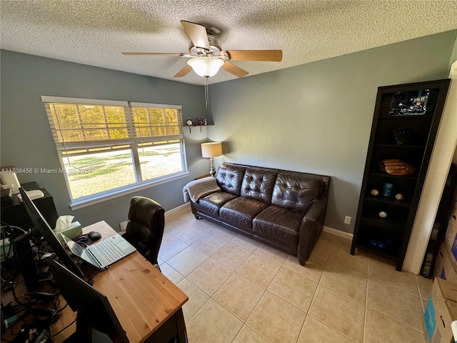 office space with ceiling fan, light tile patterned flooring, and a textured ceiling