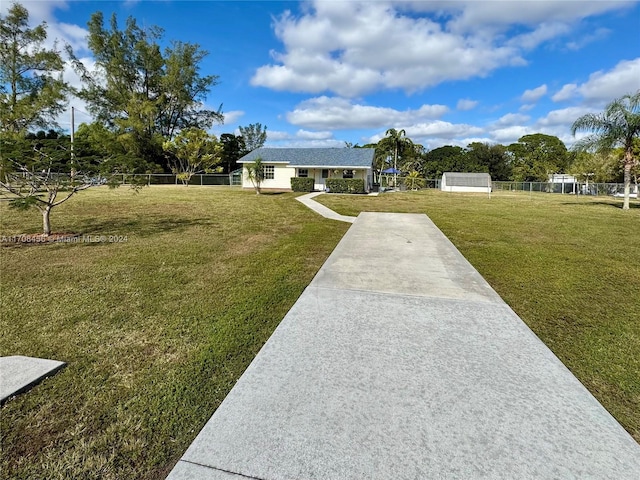 ranch-style home with a front lawn