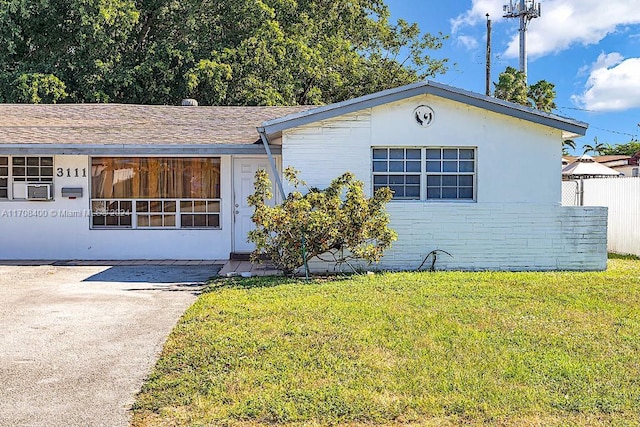 ranch-style house with a front yard