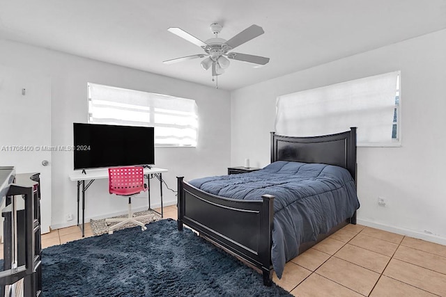 tiled bedroom featuring ceiling fan