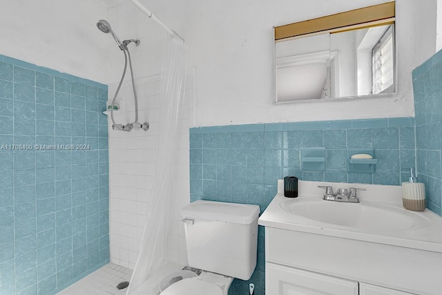 bathroom featuring a shower with curtain, vanity, tile walls, and toilet