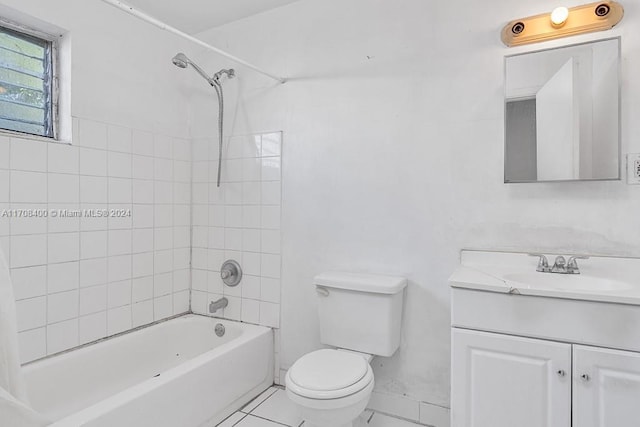 full bathroom with tile patterned floors, vanity, toilet, and tiled shower / bath