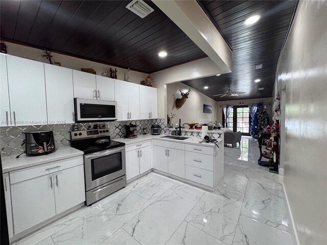 dining area featuring wooden ceiling