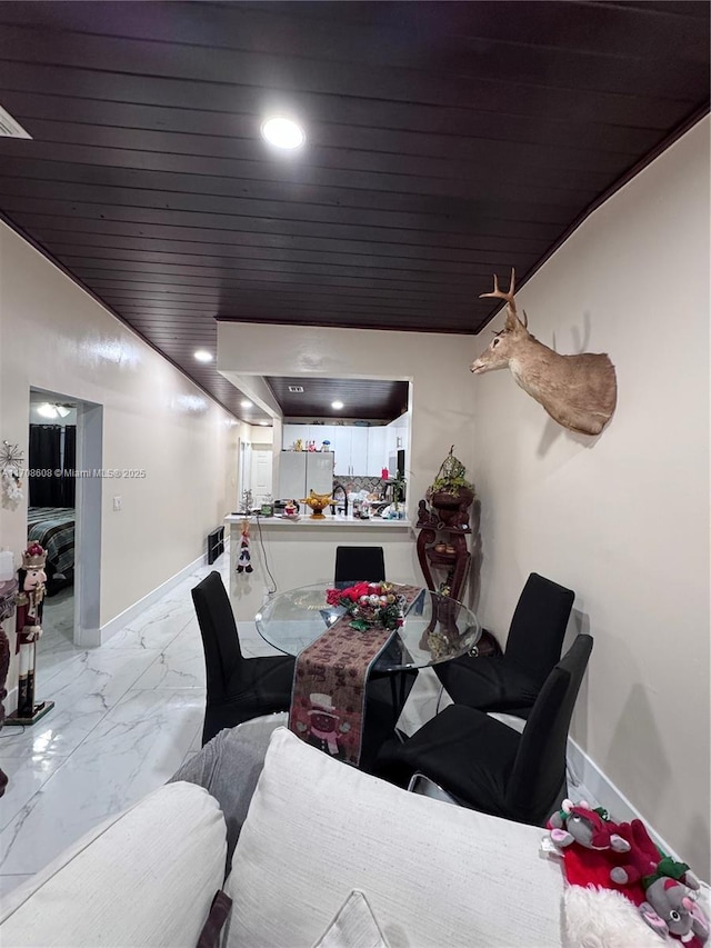 dining area with marble finish floor, recessed lighting, wooden ceiling, and baseboards