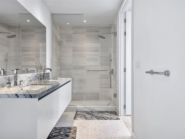 bathroom featuring tile patterned floors, vanity, and walk in shower