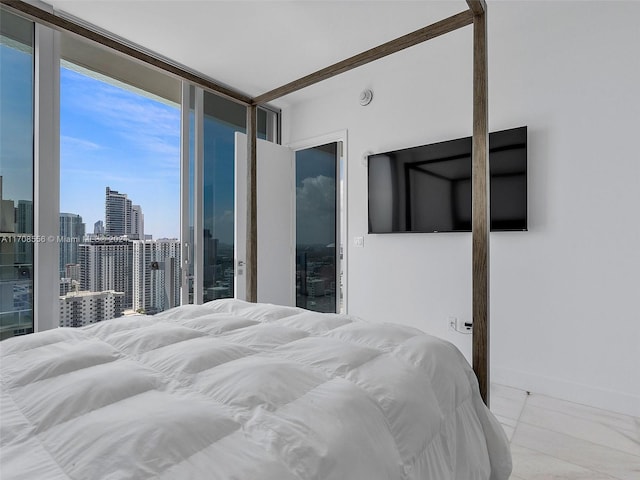 bedroom with light tile patterned floors