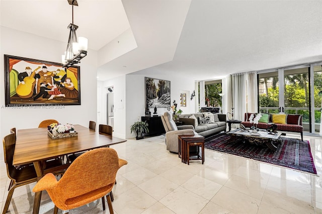 dining space featuring a notable chandelier