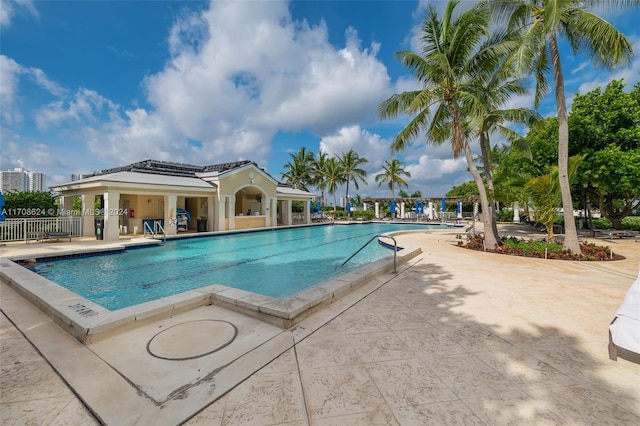 view of swimming pool with a patio area