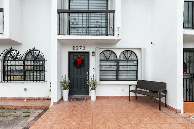 property entrance with a patio