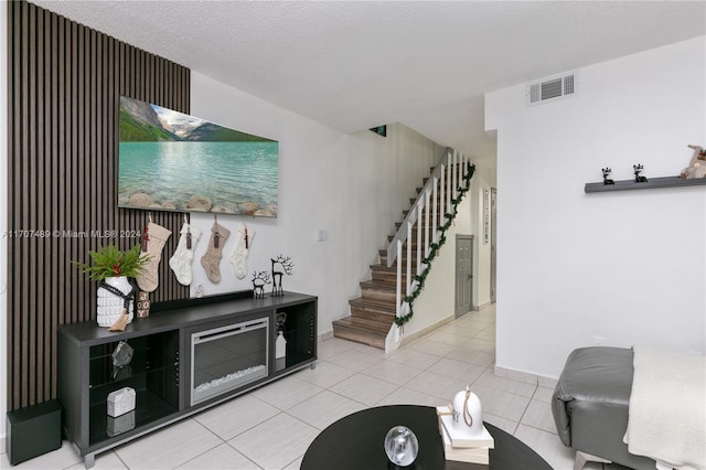 tiled living room with a textured ceiling