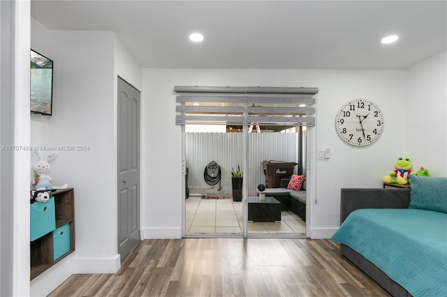 bedroom with wood-type flooring and a closet