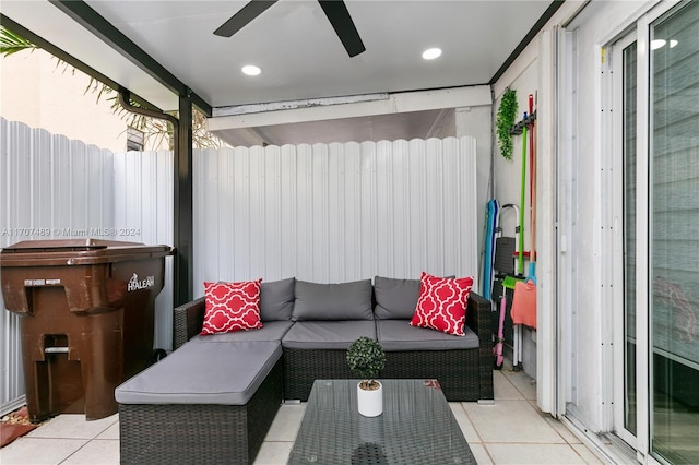 living room featuring ceiling fan and light tile patterned flooring