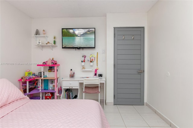 bedroom with light tile patterned floors