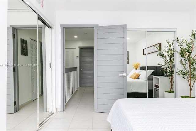 bedroom with light tile patterned flooring