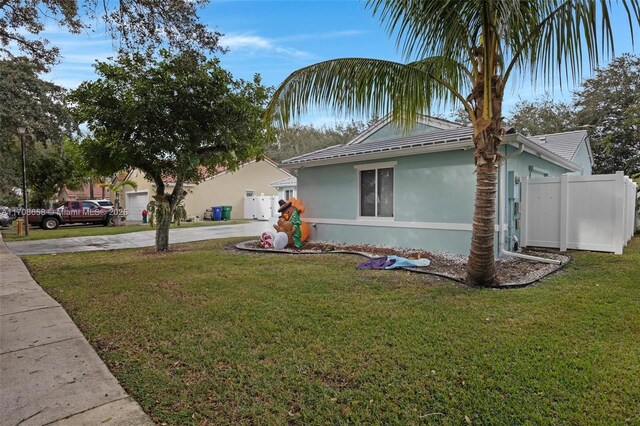 12921 SW 17th Ct, Miramar, FL 33027 - view of front of house featuring stucco siding and driveway