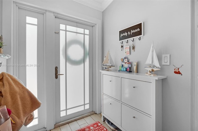 tiled entrance foyer with ornamental molding