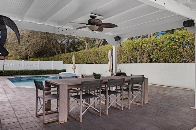 view of patio featuring ceiling fan and a fenced in pool